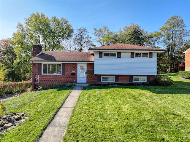 tri-level home with a front yard