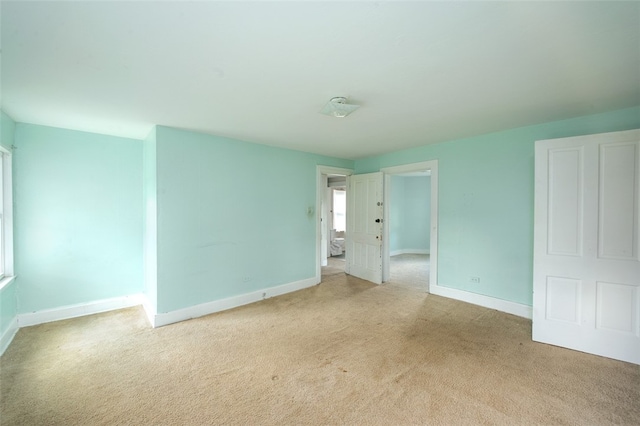 empty room with light colored carpet