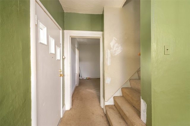 corridor featuring light carpet