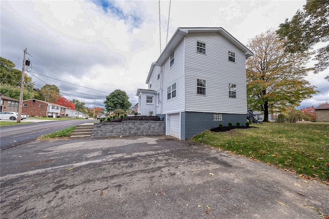 view of property exterior with a garage