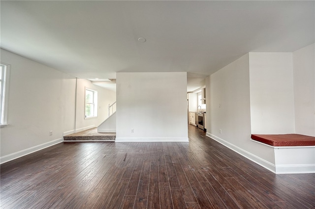 unfurnished room featuring dark hardwood / wood-style flooring