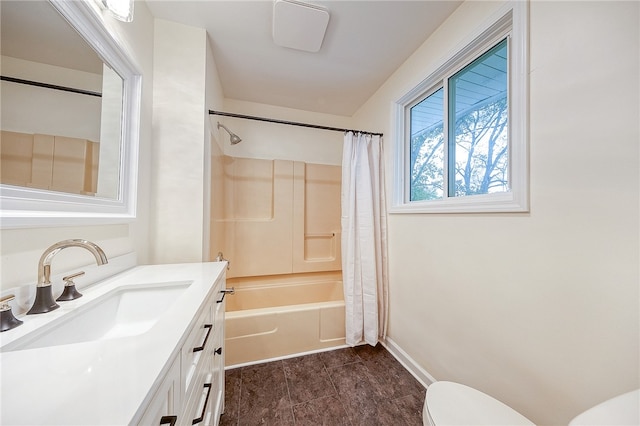 full bathroom featuring toilet, shower / tub combo with curtain, and vanity