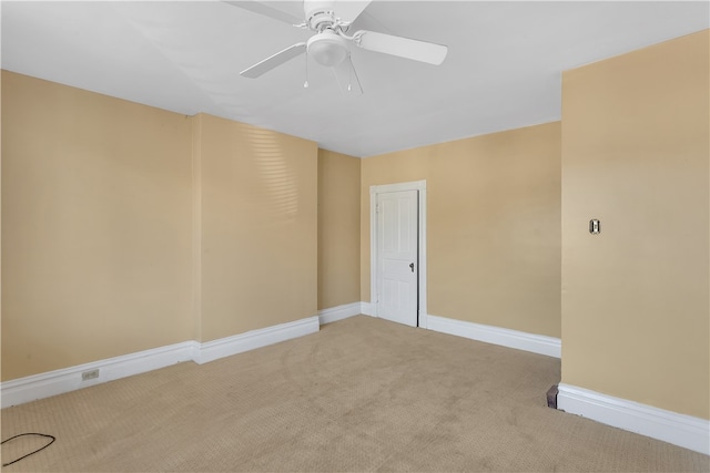 carpeted empty room with ceiling fan