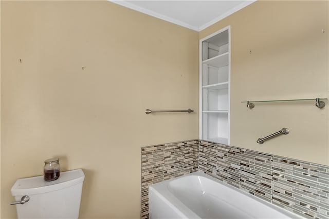 bathroom featuring toilet, ornamental molding, a bathtub, and backsplash