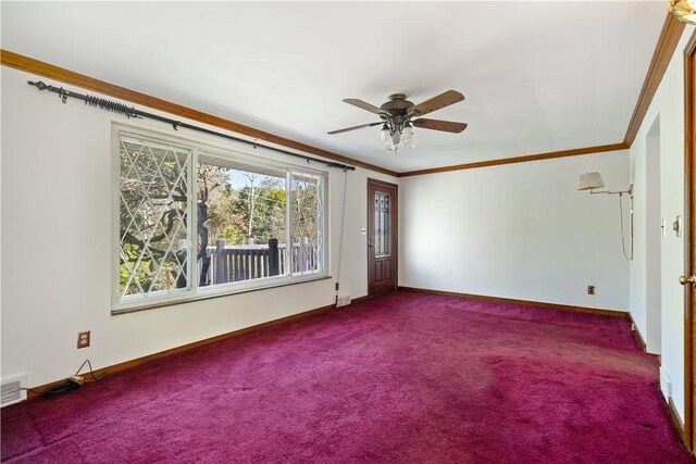 carpeted spare room featuring ornamental molding and ceiling fan