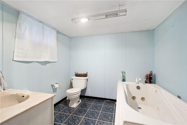 bathroom featuring toilet, sink, and a washtub