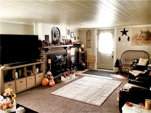 carpeted living room featuring a brick fireplace and wooden ceiling