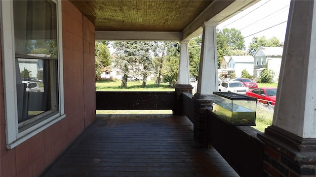 wooden terrace featuring a porch