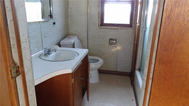 full bathroom featuring vanity, toilet, and shower / washtub combination