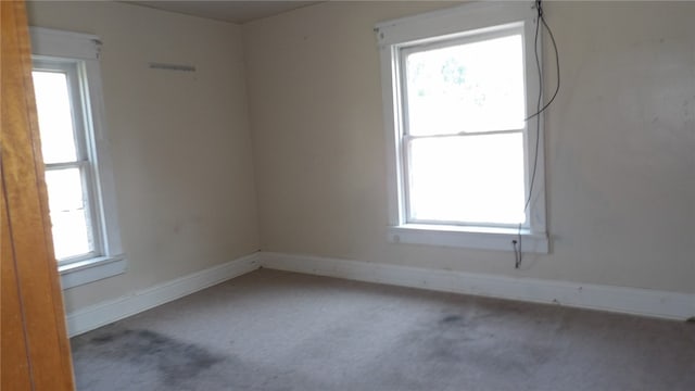 unfurnished room with carpet floors