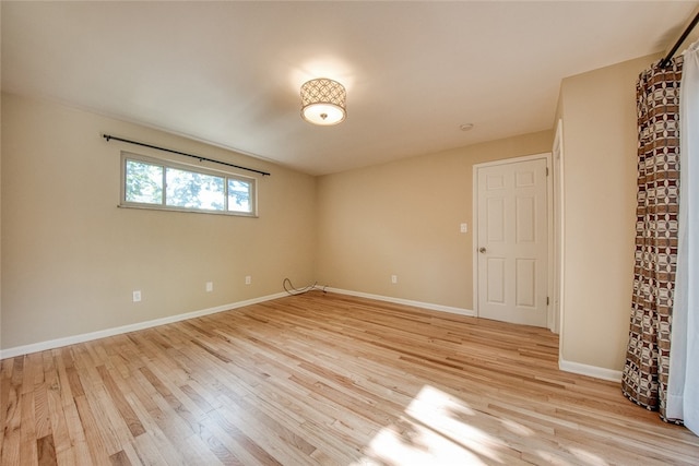 spare room with light hardwood / wood-style floors