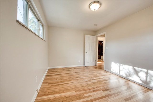 unfurnished room with light hardwood / wood-style flooring