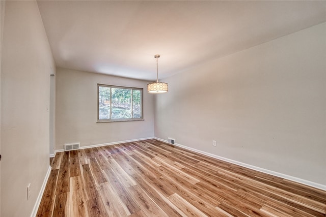 empty room featuring hardwood / wood-style floors