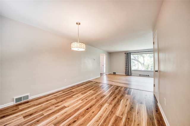 unfurnished room featuring light hardwood / wood-style floors