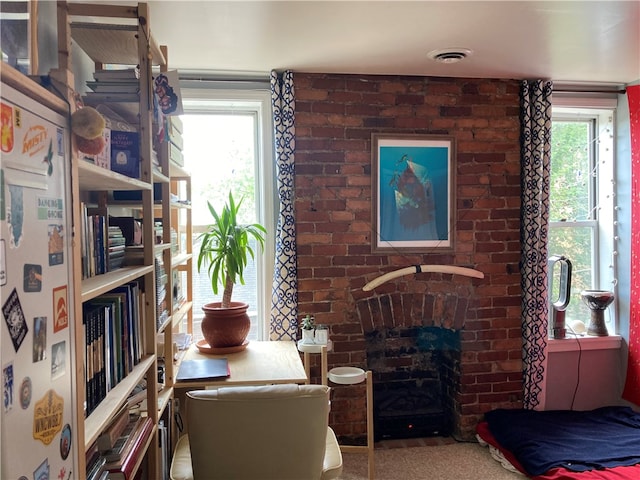 interior space featuring a fireplace and carpet flooring