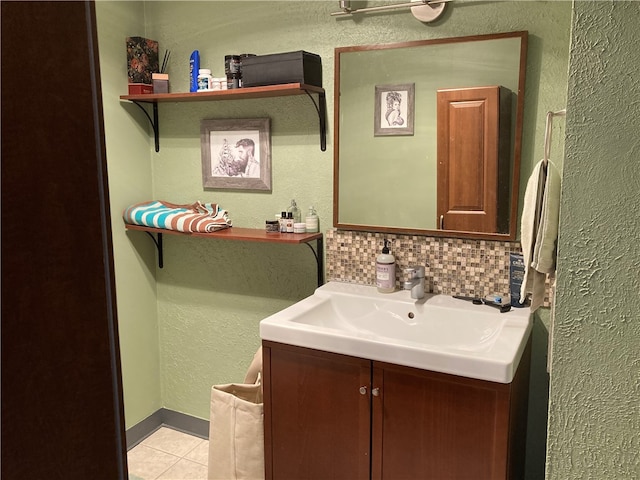 bathroom with vanity, tile patterned flooring, and tasteful backsplash