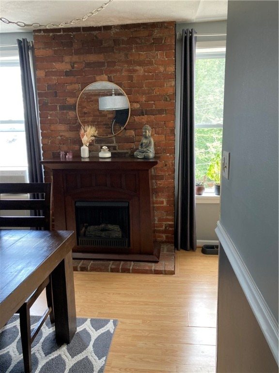 sitting room featuring light wood-type flooring and a fireplace