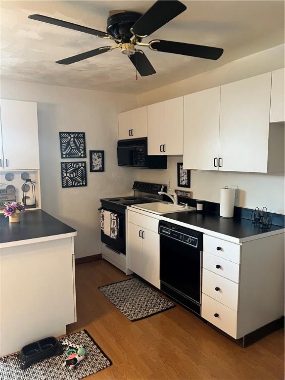 kitchen featuring white cabinetry, ceiling fan, dark wood-type flooring, and black appliances