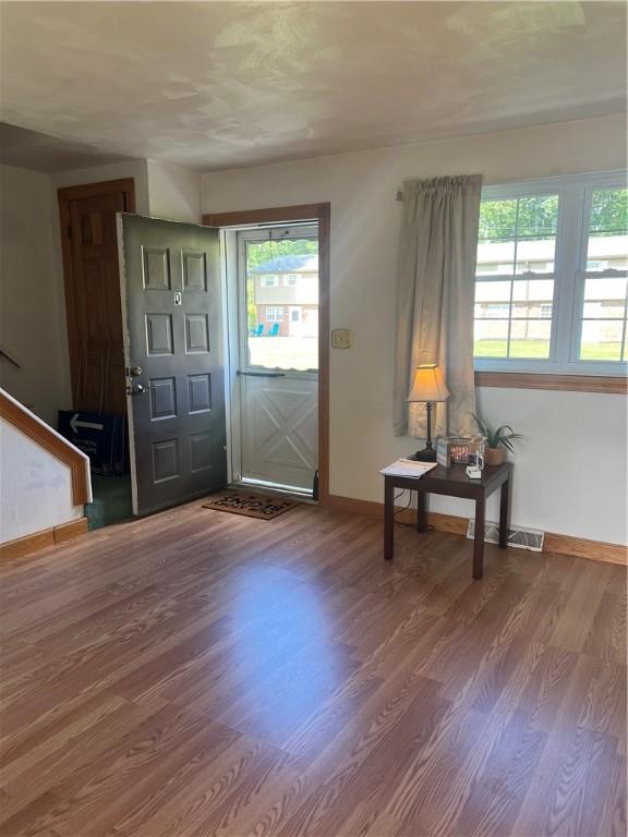 foyer entrance featuring hardwood / wood-style floors