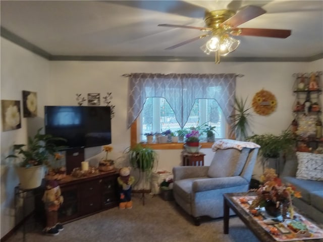 carpeted living room with crown molding and ceiling fan