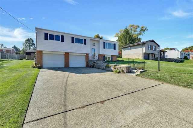 split foyer home with a front yard and a garage