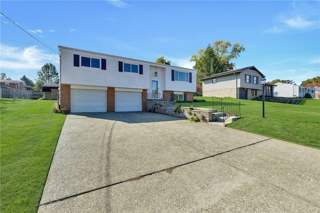 bi-level home with a front lawn and a garage