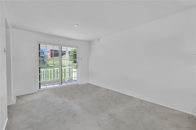 spare room with light colored carpet