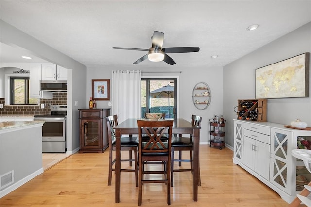 dining room featuring light wood-type flooring and ceiling fan