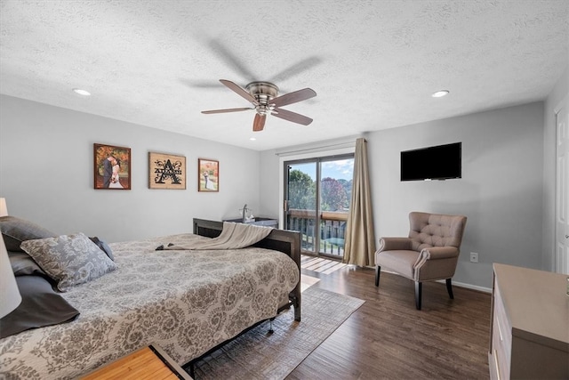 bedroom featuring dark hardwood / wood-style flooring, a textured ceiling, access to exterior, and ceiling fan