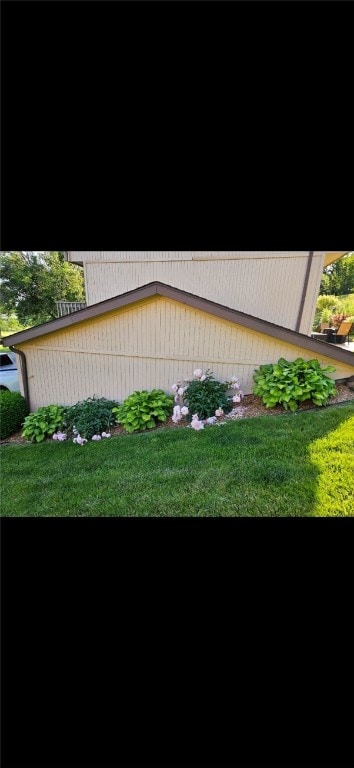 view of home's exterior with a lawn