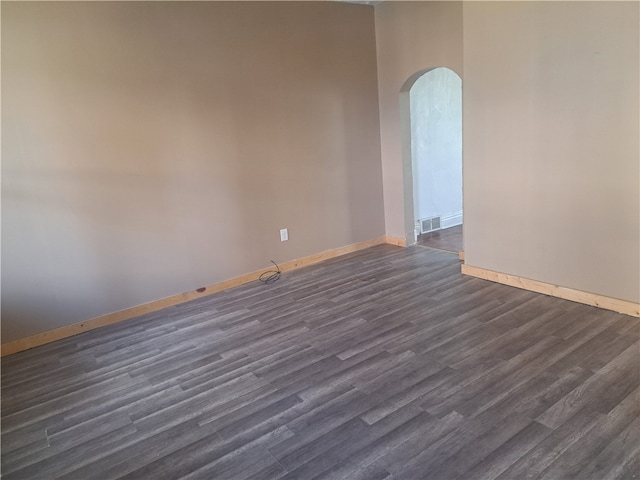 empty room featuring dark wood-type flooring