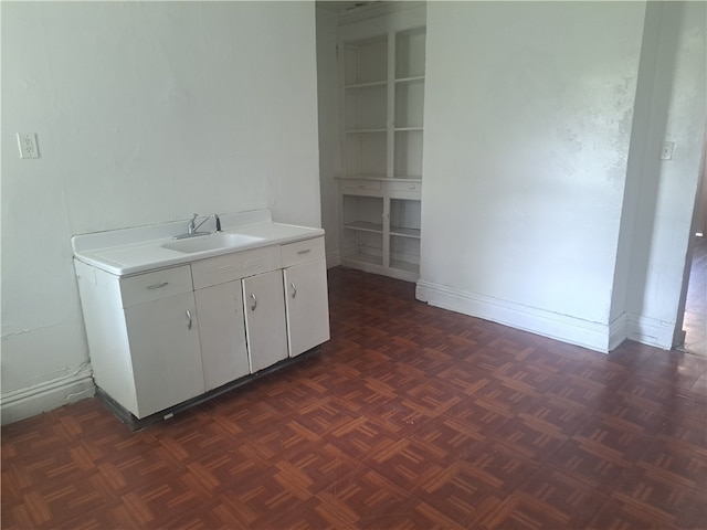 interior space featuring parquet flooring and vanity