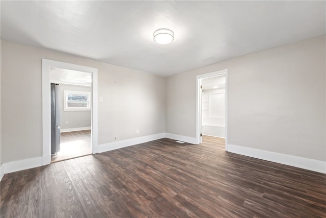 empty room featuring dark hardwood / wood-style floors