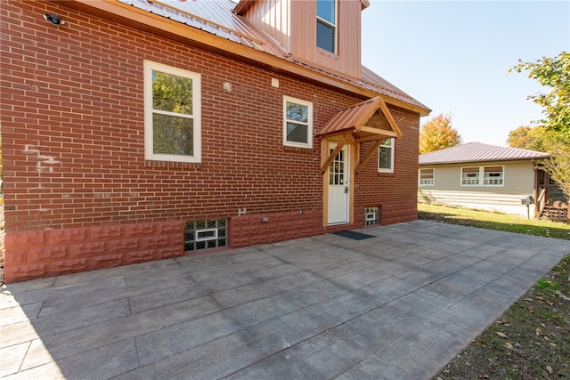 rear view of house featuring a patio