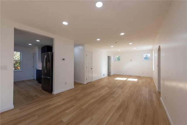 unfurnished living room featuring light hardwood / wood-style floors