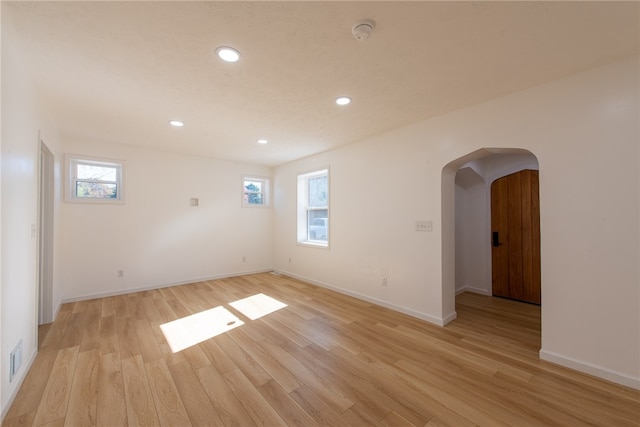 unfurnished room featuring light hardwood / wood-style flooring