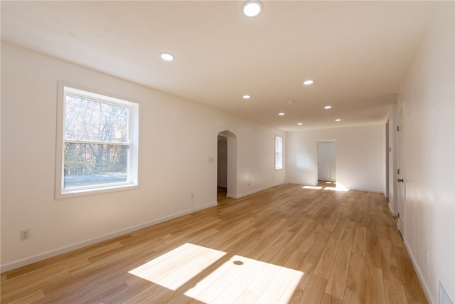 spare room with light hardwood / wood-style flooring