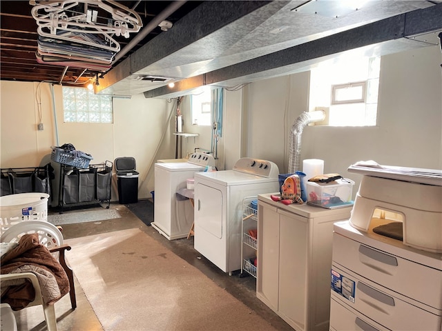 laundry room featuring washer and clothes dryer and a healthy amount of sunlight