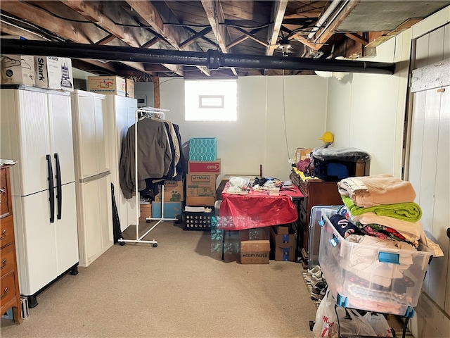 basement featuring white fridge