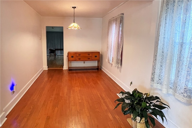 unfurnished dining area featuring hardwood / wood-style floors