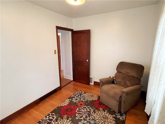 sitting room with light hardwood / wood-style flooring