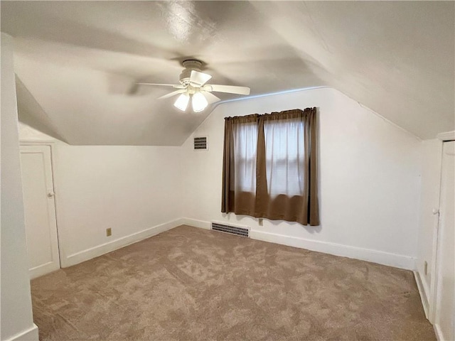 bonus room with ceiling fan, light carpet, and lofted ceiling