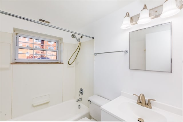 full bathroom featuring toilet, vanity, and bathing tub / shower combination