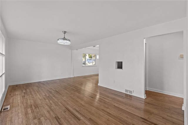 interior space featuring an inviting chandelier and hardwood / wood-style floors