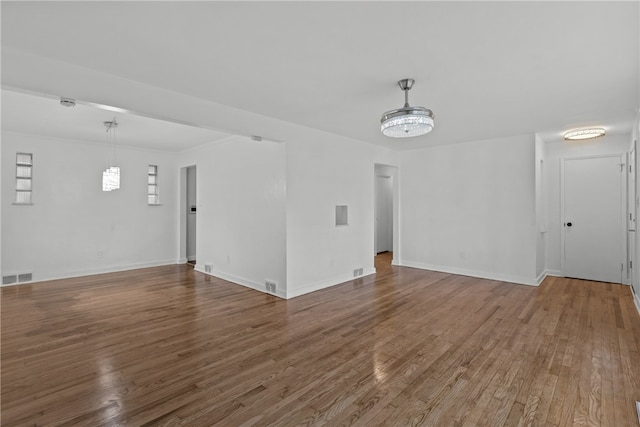 unfurnished living room featuring wood-type flooring