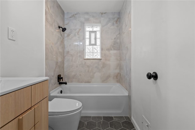 full bathroom with vanity, toilet, tiled shower / bath combo, and tile patterned flooring