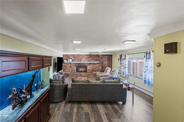 living room with dark hardwood / wood-style floors and a brick fireplace