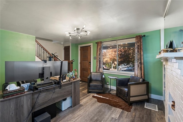 office area with a chandelier and wood-type flooring