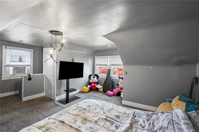 carpeted bedroom with lofted ceiling and cooling unit