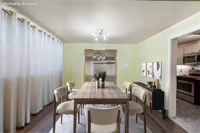 dining space with a chandelier